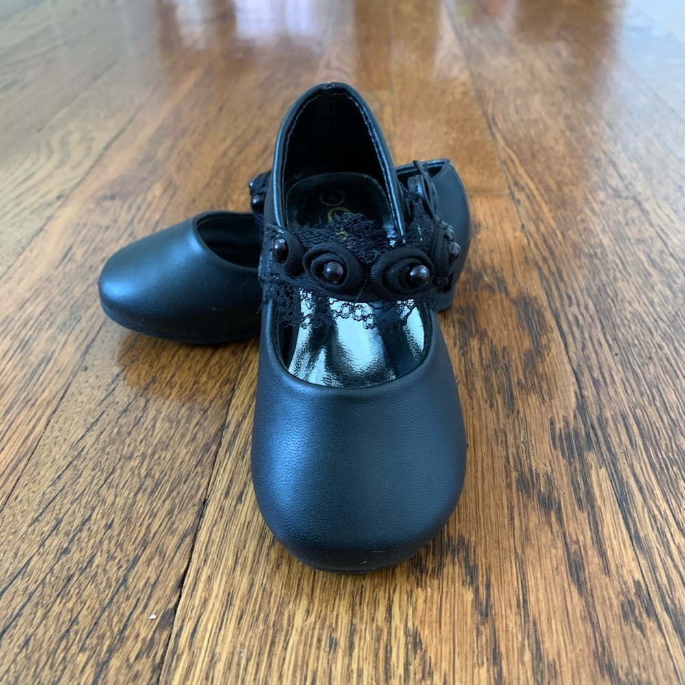 Black Mary Jane’s with lace flower strap NEW